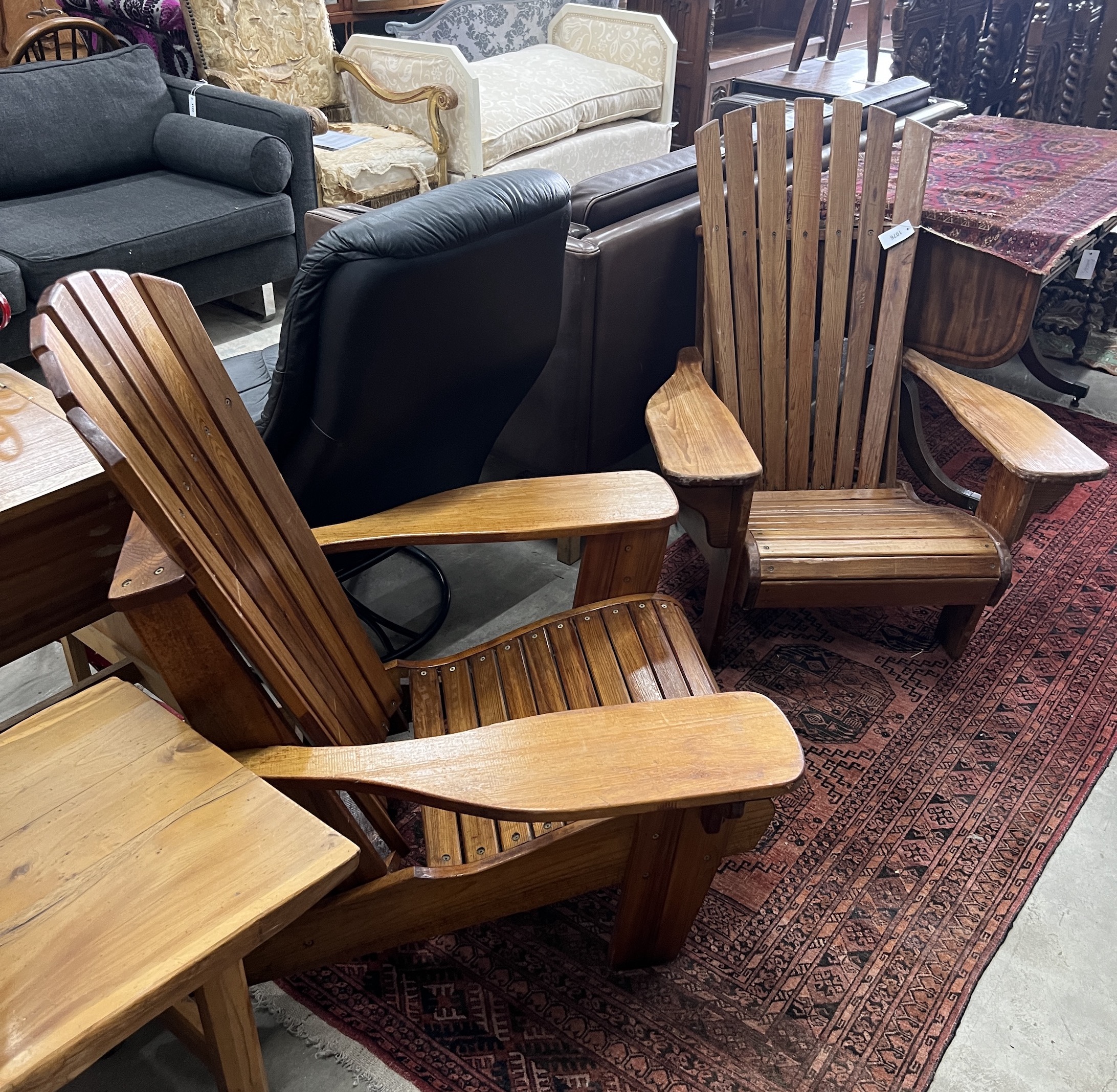 A pair of pine Adirondack chairs, stamped P J Appleby, width 79cm, depth 90cm, height 94cm